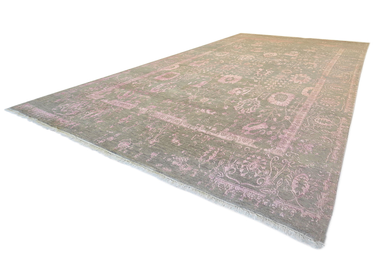 Rectangular modern area rug with faded pink and gray vintage floral design