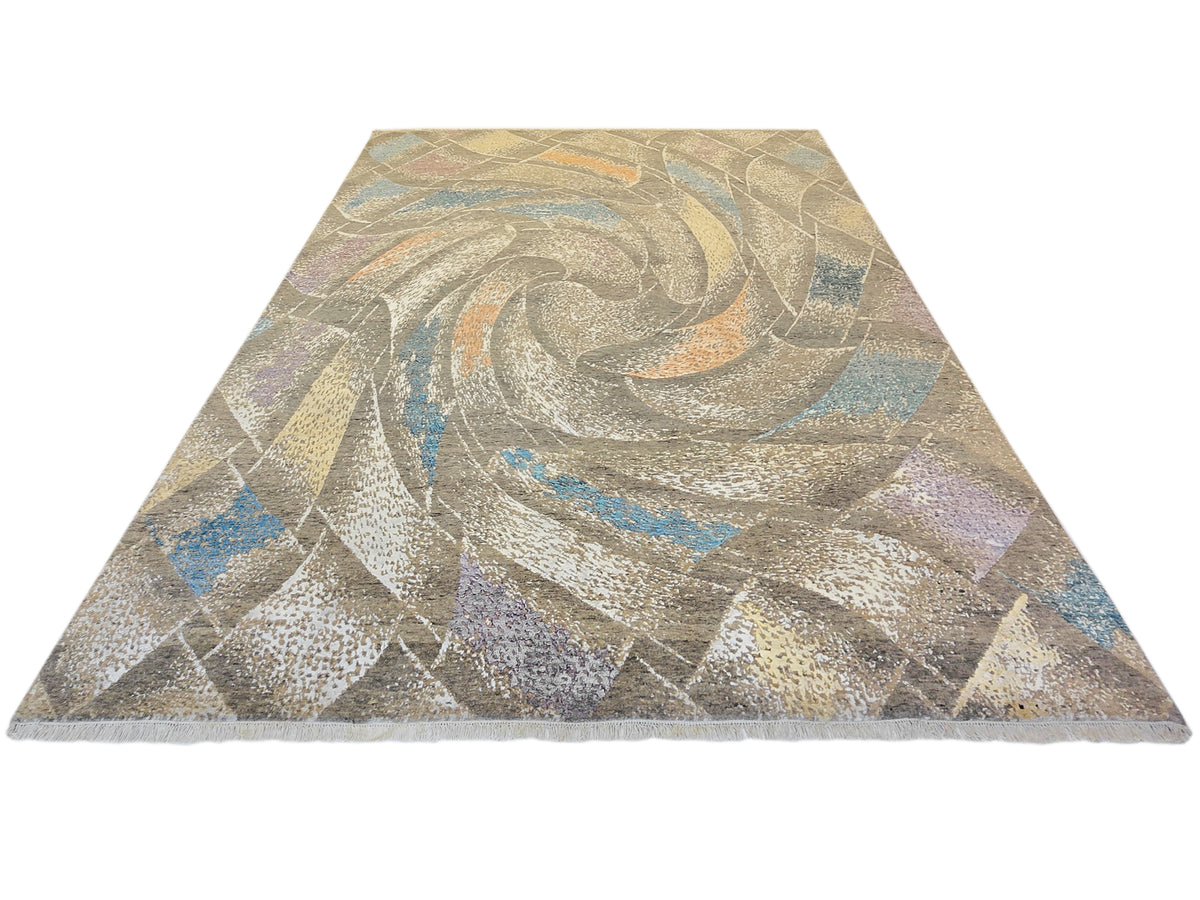Modern abstract area rug with beige and gray swirl pattern and blue accents