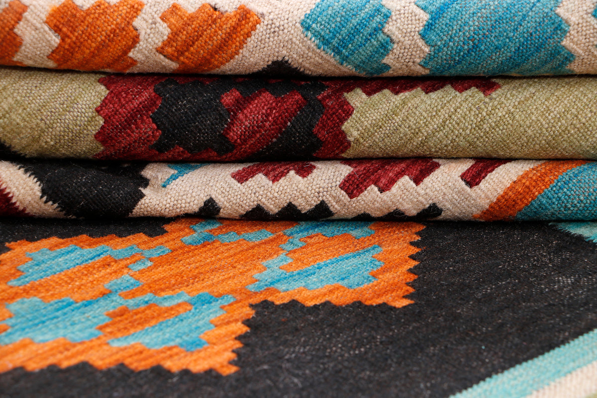 Kilim rug close-up showing woven edge details and geometric pattern bands