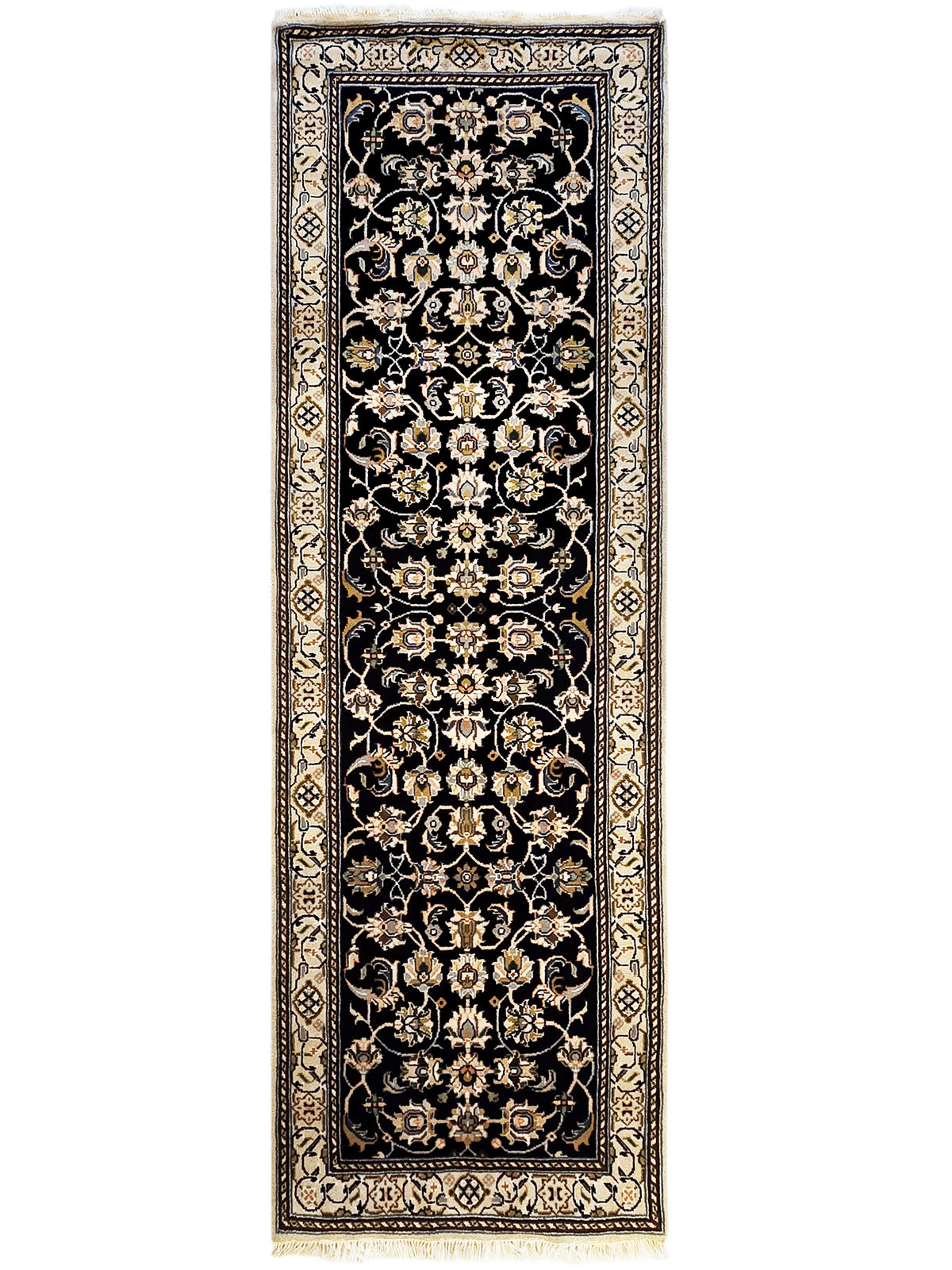 Ornate runner rug with dark navy/black field, gold and cream floral pattern