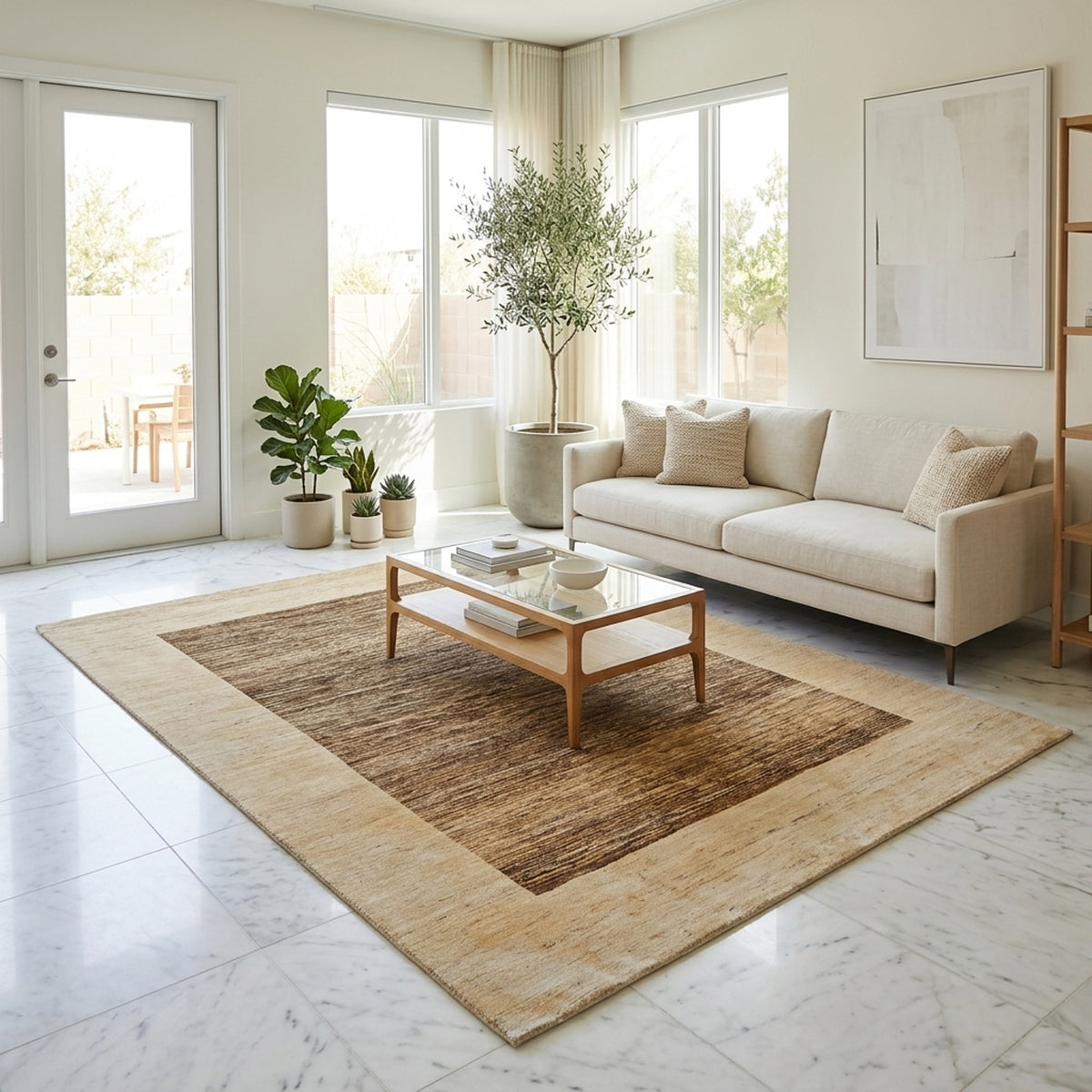 Beige and dark brown area rug with rectangular border, shown laid on the floor