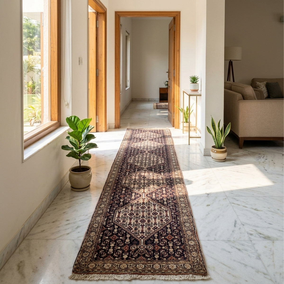 Narrow patterned runner rug in dark tones with central medallion and short cream fringe