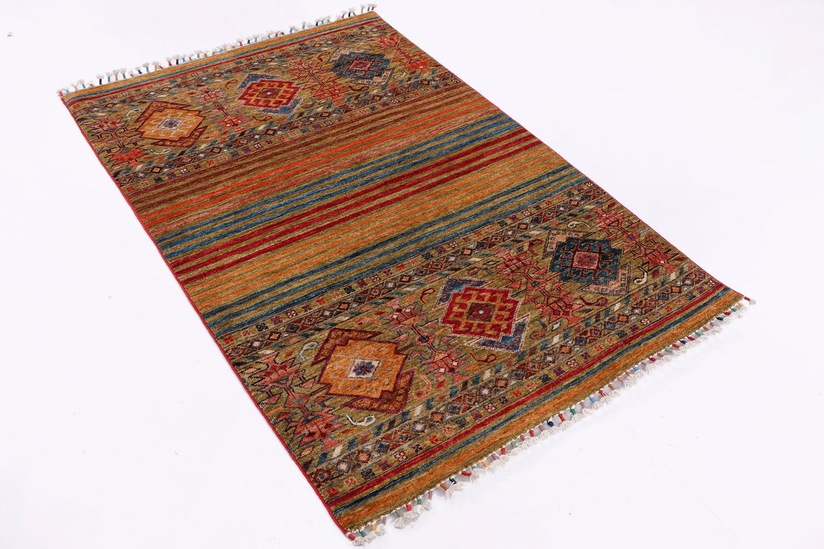 Multicolor geometric area rug with rust, blue and green stripes and diamond motifs