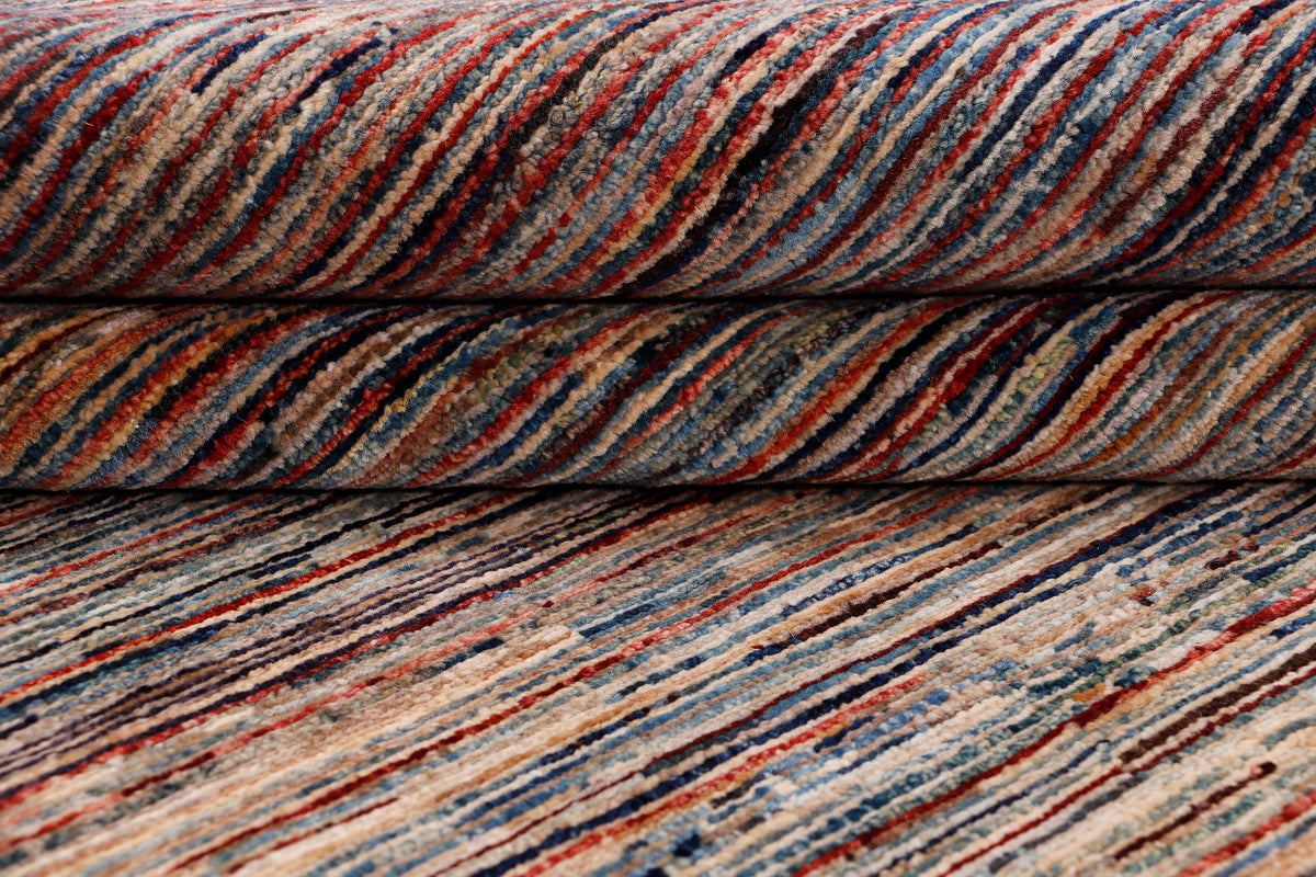 Rolled striped Ziegler-style rug showing multicolor bands with brown base