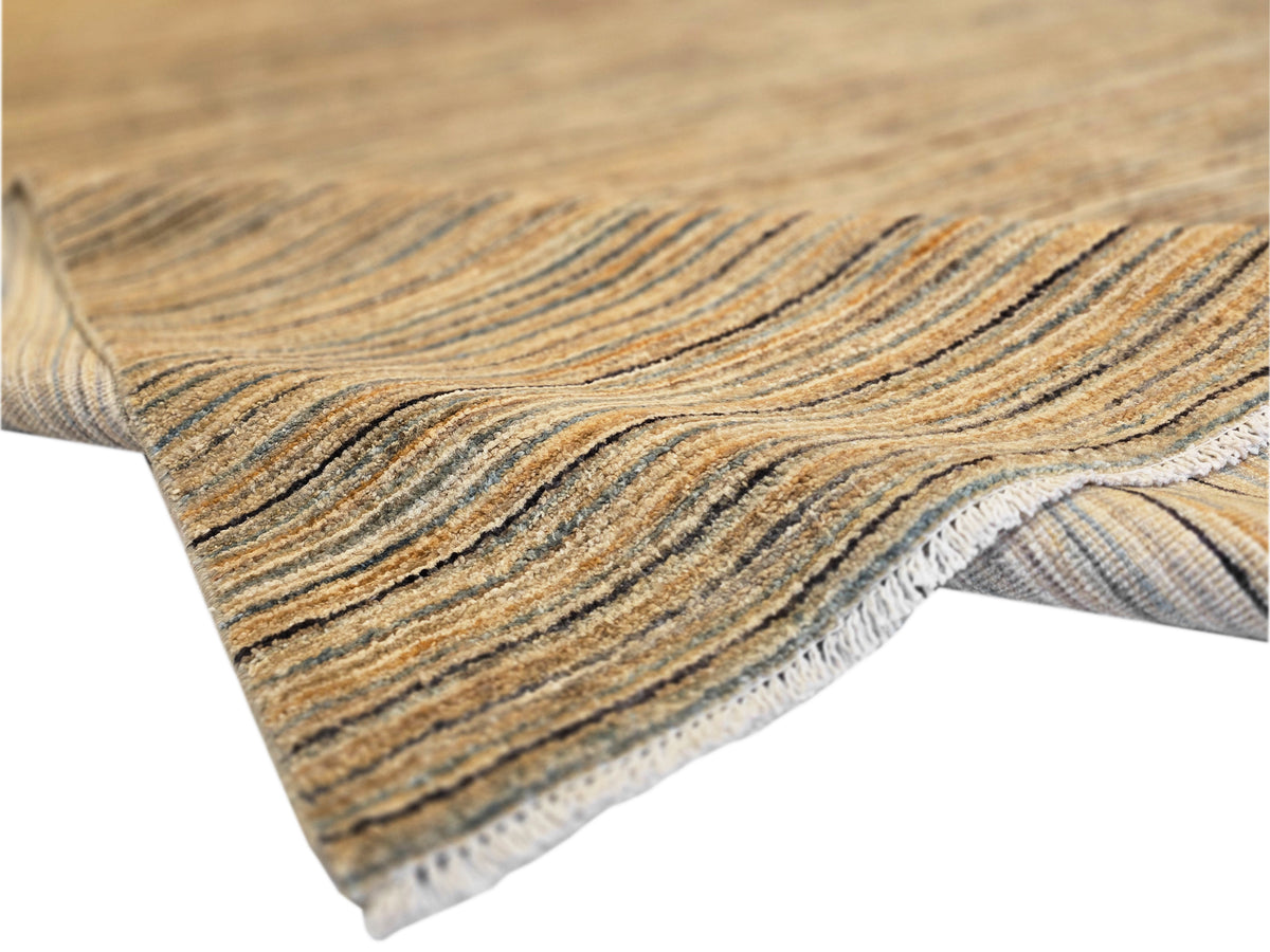 Streepje rug with striped surface and fringed edge in beige, blue, and dark gray.