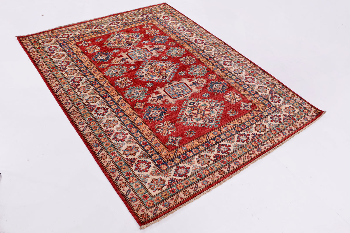 Kazak red rug laid flat with central medallion and repeating border motifs, 198x155 cm