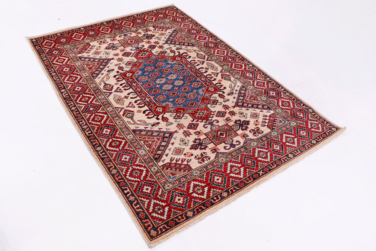 Kazak rug in blue, red and cream with ornate border, flat-lay
