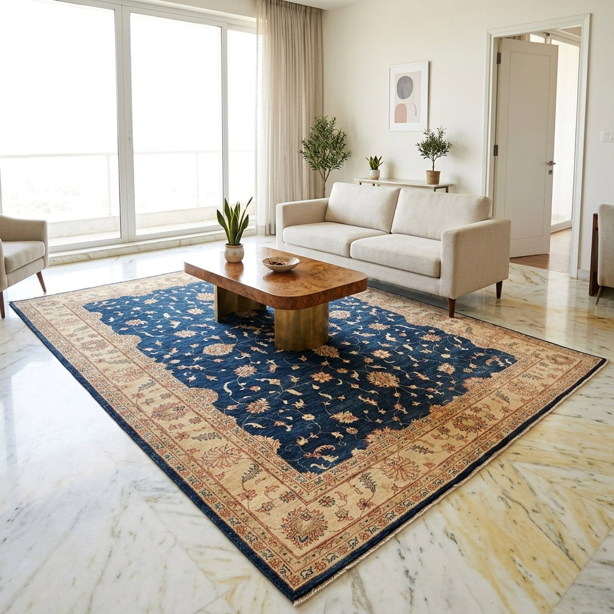 Navy floral area rug on light wood floor, cream border and red ornamental motifs.