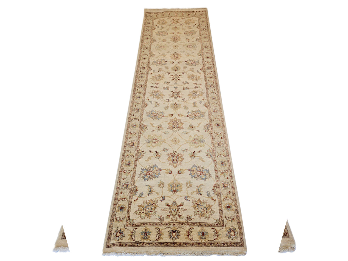 Beige floral runner rug with central medallion border and short fringe