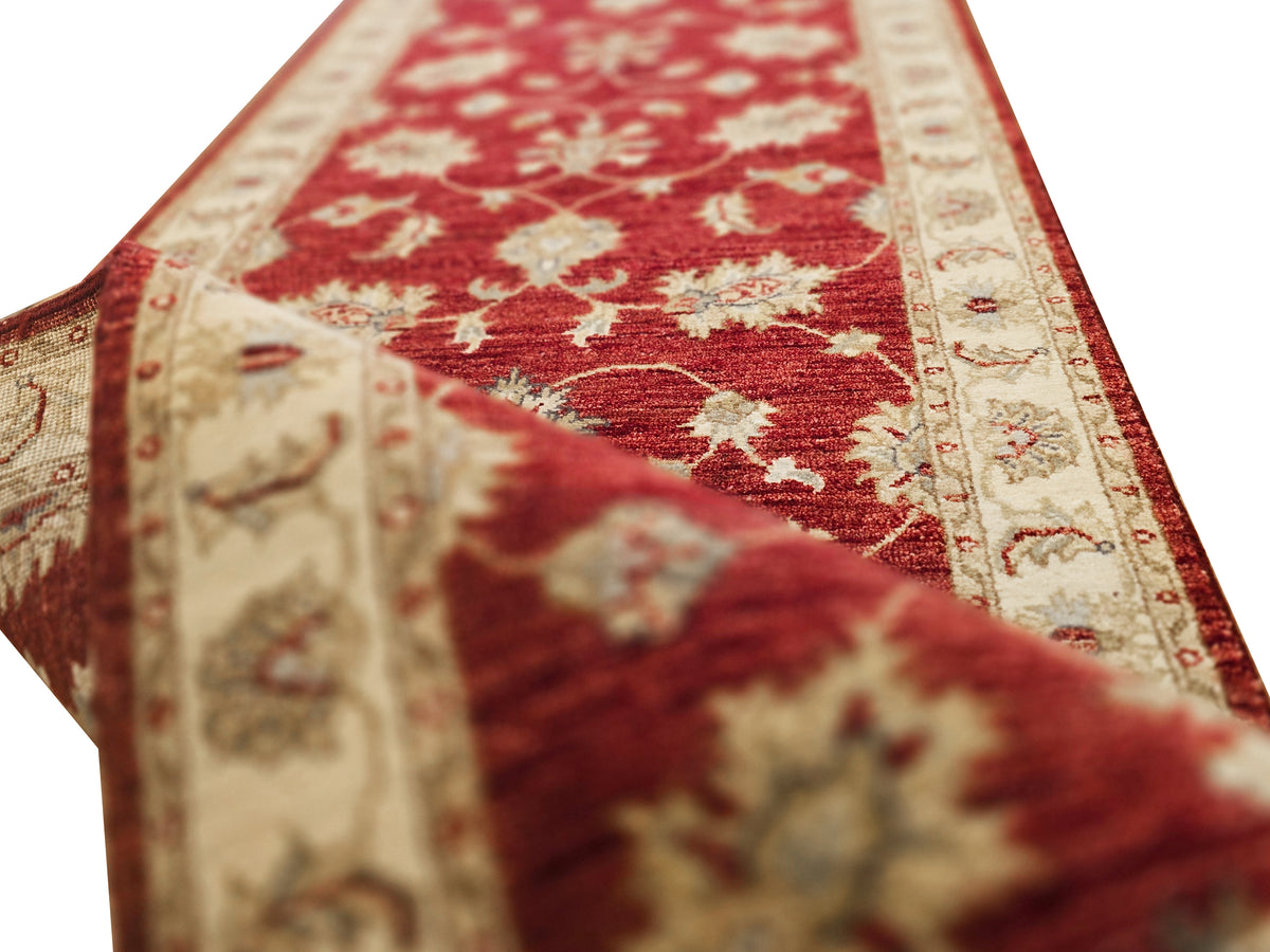 Red runner rug with cream border and detailed floral pattern, 489x80 cm