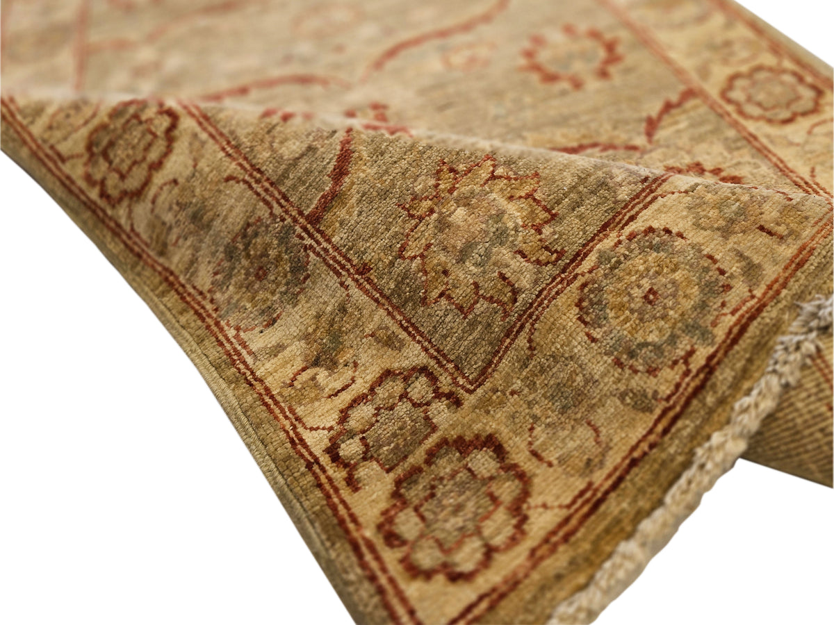 Vintage runner rug corner detail, beige and rust pattern with subtle distressed texture