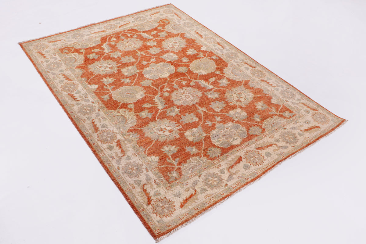 Terracotta and cream vintage-style area rug with dense floral medallion pattern.