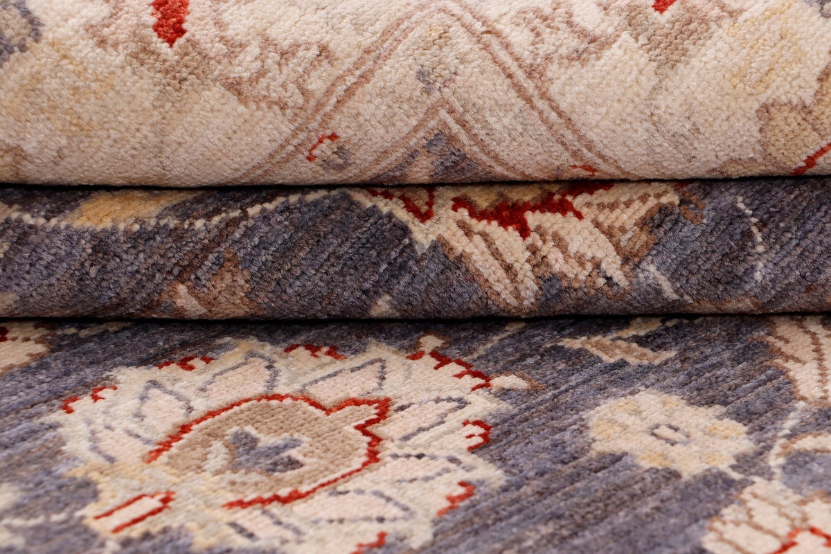 Rug pile detail with beige and dark blue pattern and small red accents